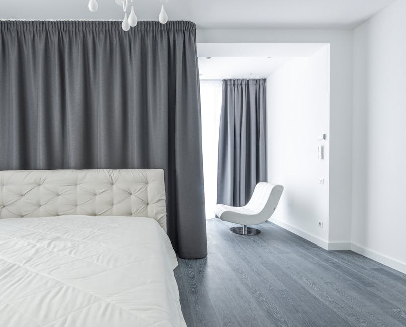 Minimalist bedroom featuring custom built wooden furniture and neutral tones